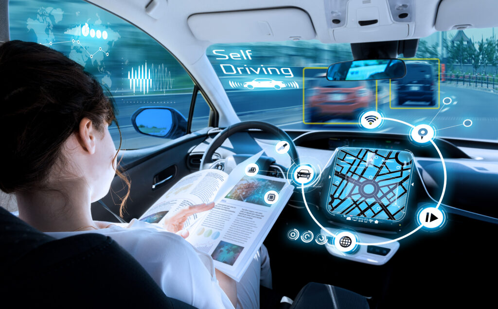 Image of person sitting in self driving car using diode laser applications 